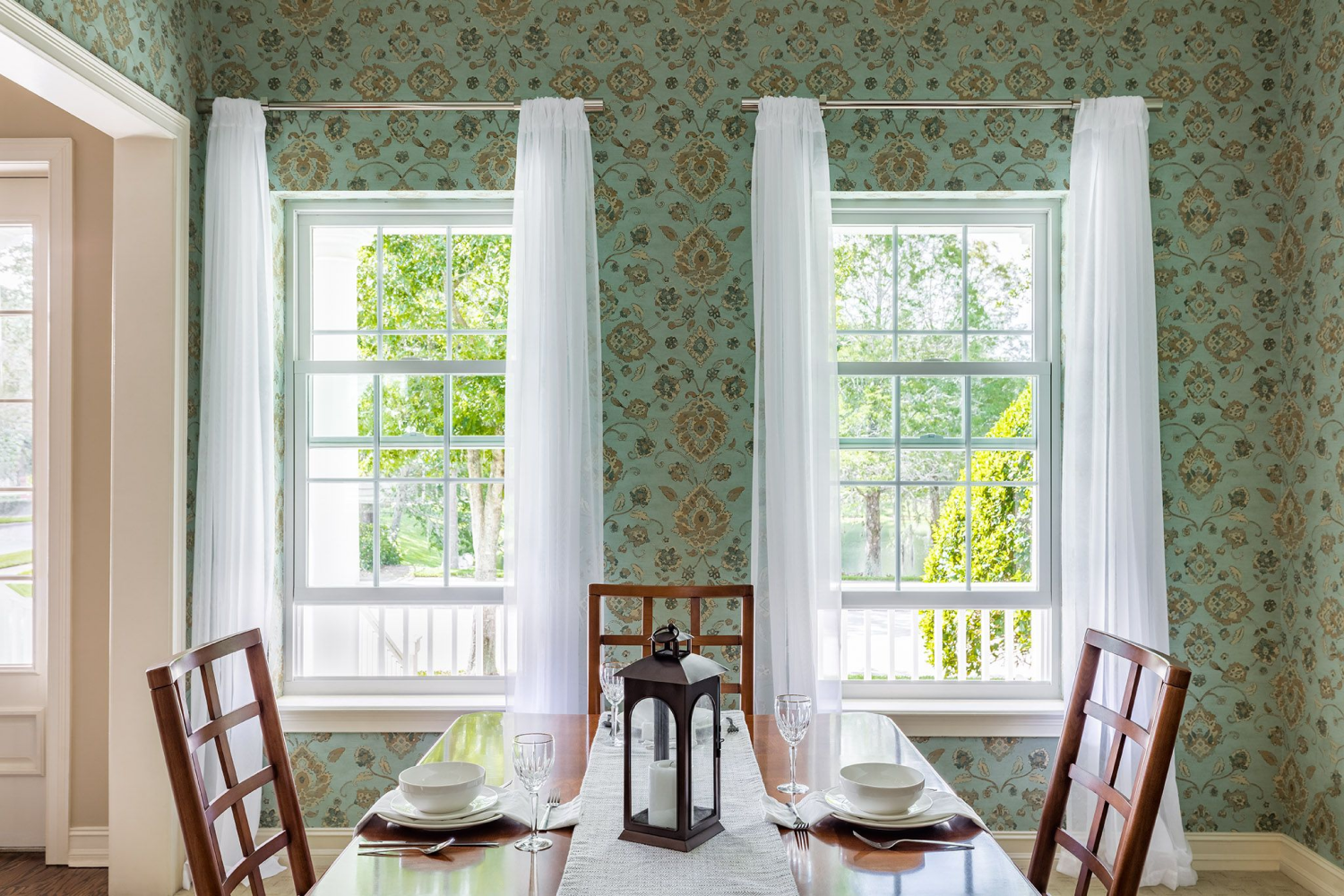 Dining room showcasing beautiful Renewal by Andersen windows