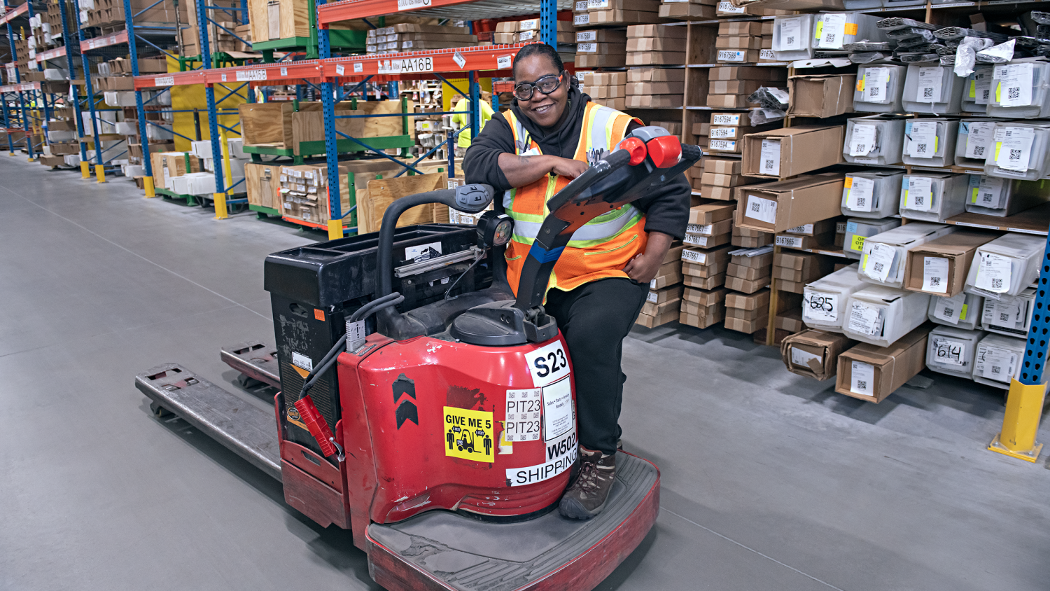 Renewal by Andersen employee sitting in a warehouse forklift