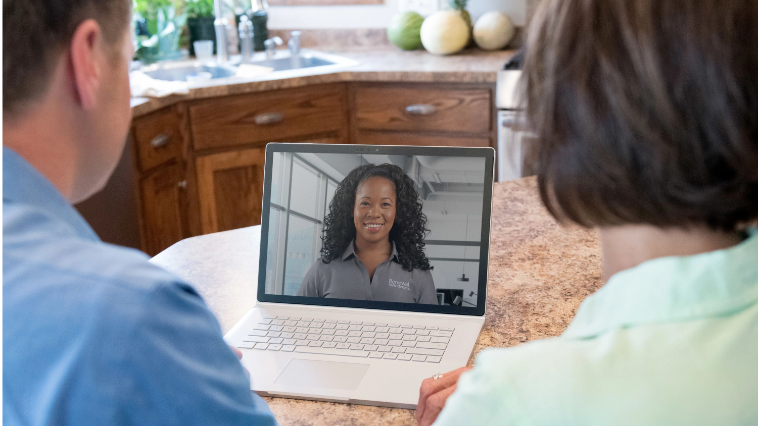 A virtual sales appointment with a Renewal by Andersen  sales person, there are two homeowners looking into a video call
