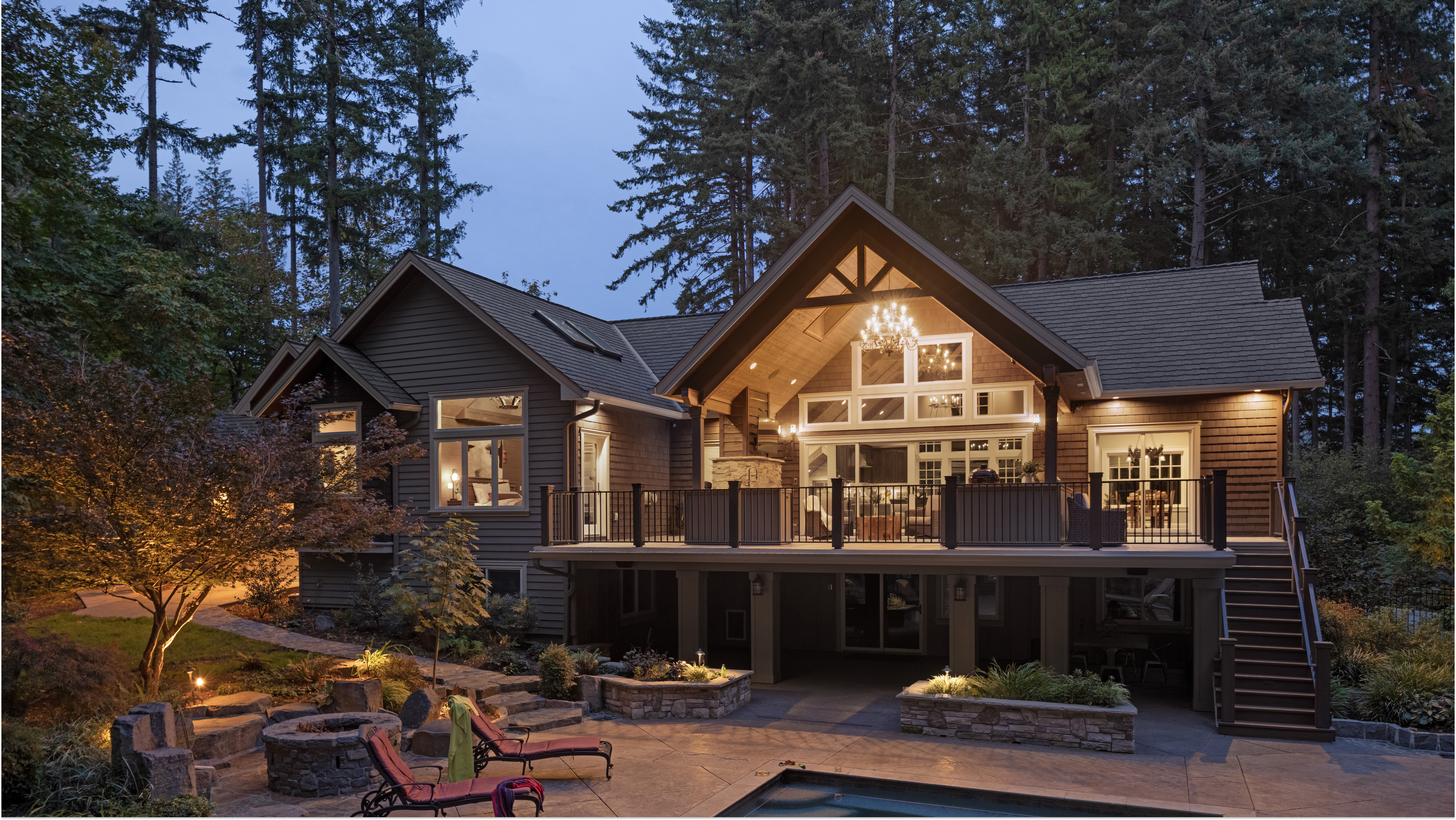 Renewal by Andersen windows enhance the beauty of a house at sunset.