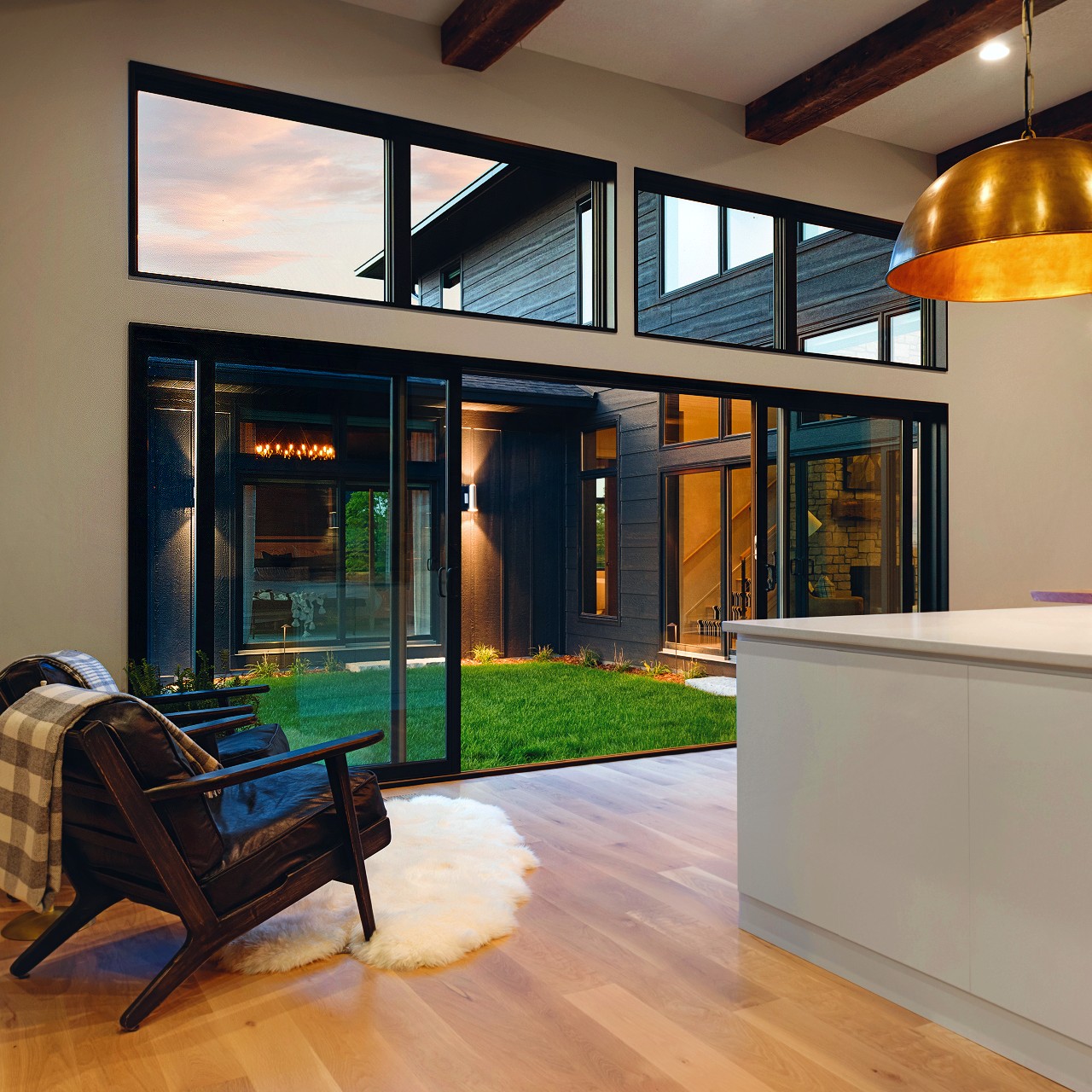 A kitchen with sliding patio doors that are 200 series.