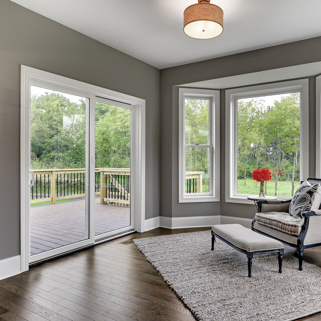 Permashield sliding patio doors. These are white patio doors with oil-rubbed bronze hardware. They are in a den.