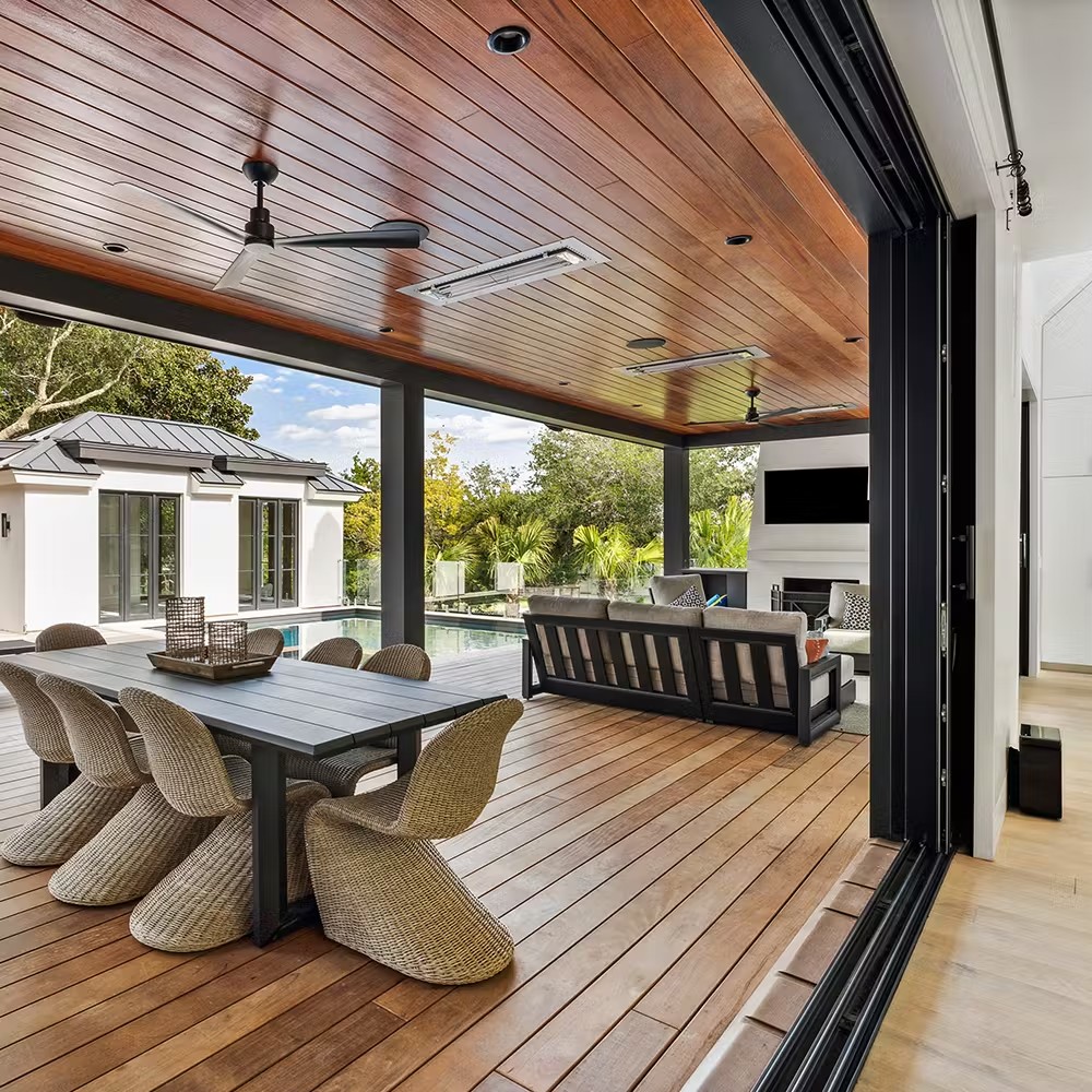 a multipanel sliding door and a dining room set