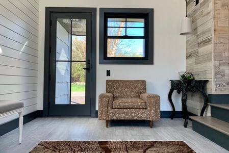 John's entry way with his a-series door and a square window.