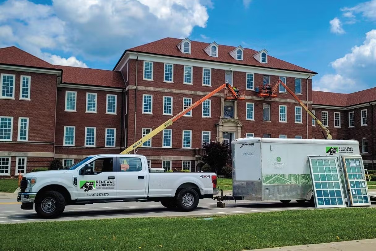 A renewal by andersen truck parked outside of the ft knox building.